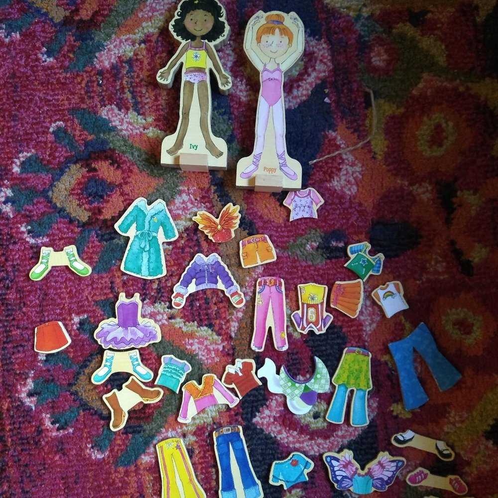 Two magnetic wooden dress up dolls